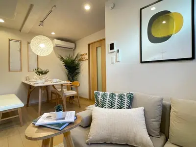 a living room with a couch and a table at \u745e\u6c90 128t in Tokyo
