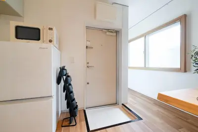 a room with a refrigerator and a window at Maison Nagasaki Five 3F MN3 in Tokyo