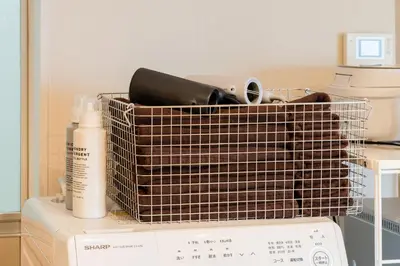 a basket sitting on top of a washing machine at Maison Nagasaki Five 3F MN3 in Tokyo