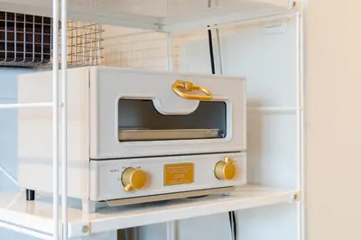 a white oven on a shelf in a refrigerator at Maison Nagasaki Five 3F MN3 in Tokyo