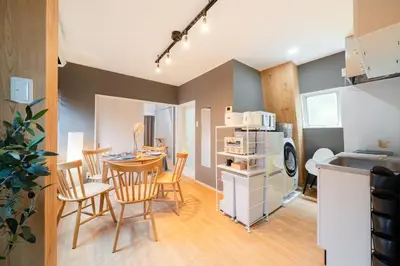 a kitchen and dining room with a table and chairs at Maison Nagasaki Five 4F MN4 in Tokyo
