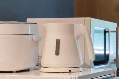two white appliances sitting on top of a counter at Maison Nagasaki Five 4F MN4 in Tokyo