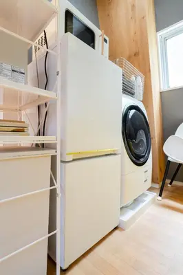 a kitchen with a refrigerator and a washing machine at Maison Nagasaki Five 4F MN4 in Tokyo