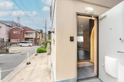 an open door of a building on a street at \u5922\u306e\u5bbf \u685c\u96c51F 131Ta in Tokyo