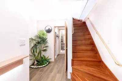 a staircase in a house with wooden flooring and a hallway at \u5922\u306e\u5bbf \u685c\u96c52F-3F 131Tb in Tokyo