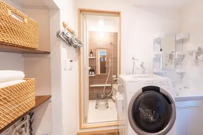 a laundry room with a washing machine and a sink at \u5922\u306e\u5bbf \u685c\u96c52F-3F 131Tb in Tokyo