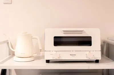 a white toaster oven on a shelf with a blender at \u5922\u306e\u5bbf \u685c\u96c52F-3F 131Tb in Tokyo