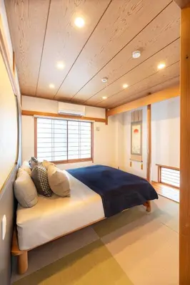 a bedroom with a large bed in a room at \u5922\u306e\u5bbf \u685c\u96c52F-3F 131Tb in Tokyo