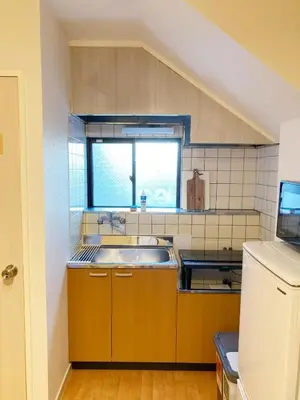 a small kitchen with a sink and a window at K&H立石5丁目m305 in Tokyo