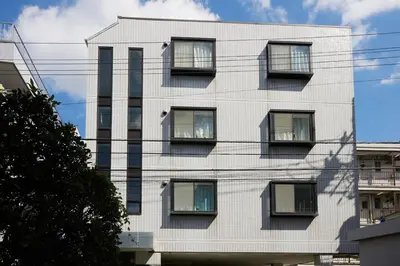 a white building with windows on the side of it at K&H立石5丁目m305 in Tokyo