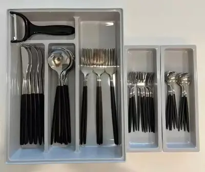 a plastic container filled with forks and spoons at Hotel Shunkashuto Sakura 1 min to station in Tokyo