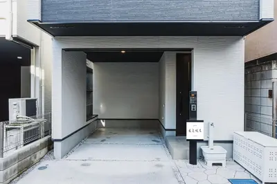 a hallway of a building with a door and a toilet at Hotel Shunkashuto Sakura 1 min to station in Tokyo