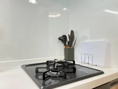 a stove top oven sitting on top of a kitchen counter at nestay apartment tokyo skytree in Tokyo