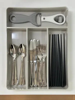 a drawer filled with silver utensils and scissors at nestay apartment tokyo skytree in Tokyo