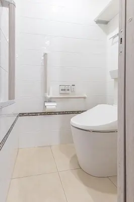 a white bathroom with a toilet and a sink at Asakusa Cozy Japanese House with Tatami & Projector, 5min to Station in Tokyo