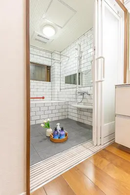 a bathroom with a shower and a sink in a room at Asakusa Cozy Japanese House with Tatami & Projector, 5min to Station in Tokyo