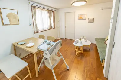 a living room with a table and a chair at Asakusa Cozy Japanese House with Tatami & Projector, 5min to Station in Tokyo