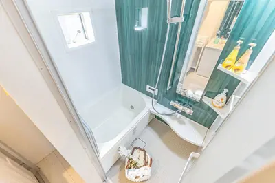 a small bathroom with a shower and a toilet at 7 min walk from JR Yamanote Line Uguisudani Spacious 4-Bedroom House near Ueno & Asakusa With Parking in Tokyo