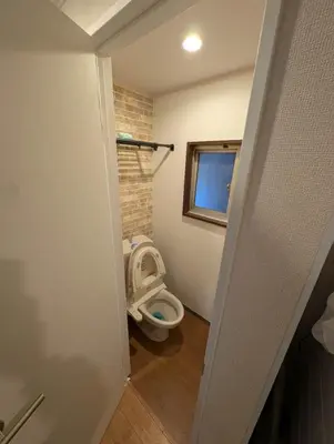 a small bathroom with a toilet in a room at SunRise STAY Minamidai\u4e2d\u91ce\u5357\u53f0 in Tokyo