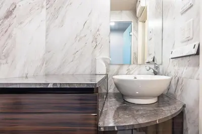 a bathroom with a white sink and a mirror at 101 Direct to Narita Haneda 5-minute walk from Keikyu Kamata Station, with kitchen, ideal for telework, apartment in Tokyo
