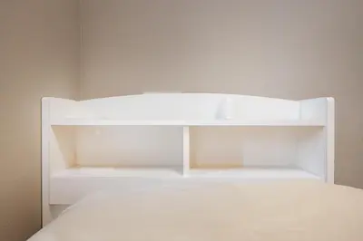 a white bunk bed with white shelves in a room at 201 Direct access to Narita Haneda 5-minute walk to Keikyu Kamata Station, with kitchen, ideal for telework, apartment in Tokyo