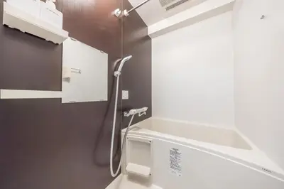 a bathroom with a shower with a sink and a toilet at 402 Direct access to Narita Haneda 5-minute walk from Keikyu Kamata Station with kitchen, ideal for telework, apartment in Tokyo