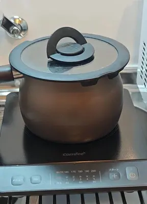 a slow cooker sitting on top of a stove at Pearl Heights 102 Traditional Japanese-style private apartment for 1-4 people, close to Ikebukuro Shinjuku business district in Tokyo