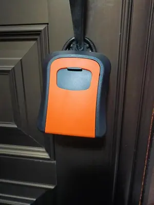 an orange object is hanging on a door at Pearl Heights 301 suit room, Easy access to Ikebukuro Shinjuku Station in Tokyo