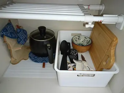 a drawer in a refrigerator filled with kitchen utensils at Pearl Heights 201 Easy access to Ikebukuro Shinjuku, Cozy 1 room in Tokyo