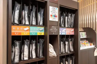 a store with a bunch of shoes on shelves at Sanco Inn Grande Tokyo Hamamatsucho in Tokyo