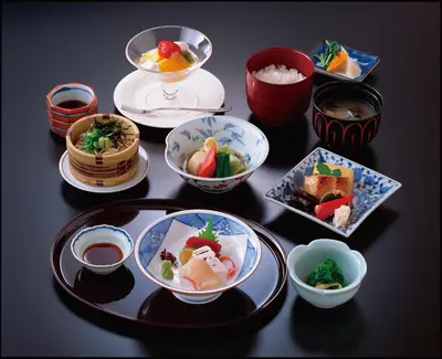 a group of bowls and plates of food on a table at Hotel New Otani Tokyo EXECUTIVE HOUSE ZEN in Tokyo