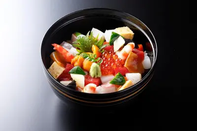 a black bowl filled with fruits and vegetables at Hotel New Otani Tokyo EXECUTIVE HOUSE ZEN in Tokyo