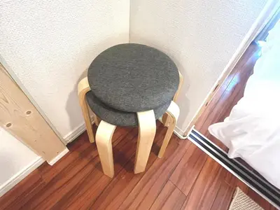 a small chair sitting in the corner of a room at Shinjuku 10 min walk, Higashi Shinjuku 4 min, Kabukicho, Shin-Okubo apartment in Tokyo