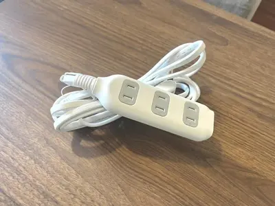 a white remote control sitting on top of a table at Shinjuku 10 min walk, Higashi Shinjuku 4 min, Kabukicho, Shin-Okubo apartment in Tokyo