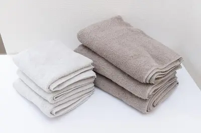 a pile of towels sitting on top of a counter at \u30e1\u30eb\u30c7\u30a3\u30a2\u6771\u5800\u5207 in Tokyo