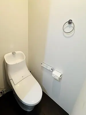 a white toilet in a bathroom with a roll of toilet paper at Tokyo Stay Top Ikebukuro #103 in Tokyo