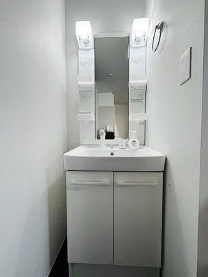 a bathroom with a sink and a mirror at Tokyo Stay Top Ikebukuro #103 in Tokyo