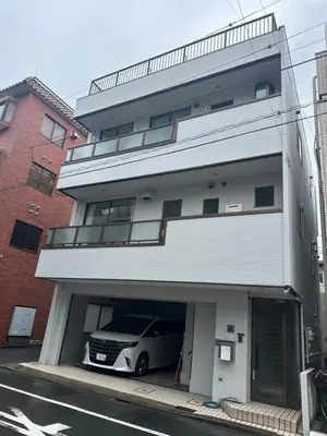 a car is parked inside of a parking garage at SKY inn 1F in Tokyo