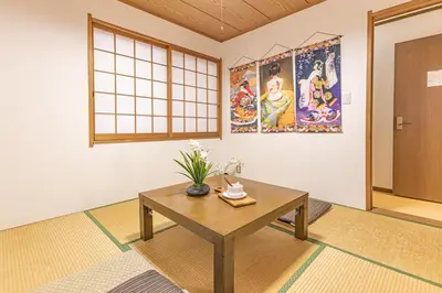 a room with a table with flowers on it at Nishiikebukuro 4people, 2mins to subway in Tokyo