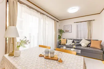 a living room with a table and a couch at Nishiikebukuro 4people, 2mins to subway in Tokyo