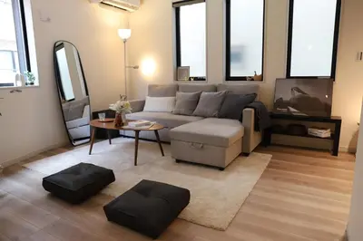 a living room with a couch and a table at Shibuya house w Rooftop, 6min to Station, Skyline View in Tokyo