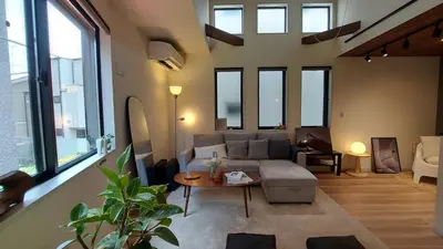 a living room with a couch and a table at Shibuya house w Rooftop, 6min to Station, Skyline View in Tokyo