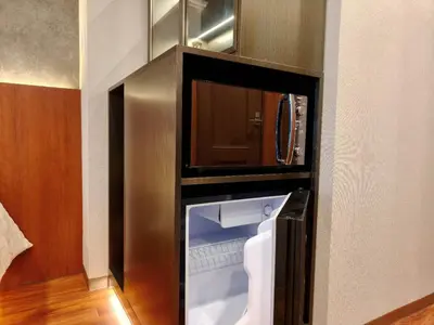 an empty refrigerator in a cabinet in a room at D3 Shinjuku Business District hotel, 9 mins to ST Max 4P \u65b0\u5bbf\u5546\u52a1\u533a \u5168\u65b0\u88c5\u4fee \u4ea4\u901a\u4e2d\u5fc3 \u8f66\u7ad99\u5206\u949f \u6700\u59274\u4eba \u76f4\u8fbe\u65b0\u5bbf \u6d89\u8c37 \u8868\u53c2\u9053 \u54c1\u5ddd \u6c60\u888b \u4e0a\u91ce \u4ee3\u4ee3\u6728 \u94f6\u5ea7 \u539f\u5bbf in Tokyo
