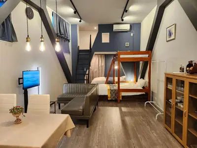 a living room with a couch and a bunk bed at Ark Hills Haneda Inn in Tokyo