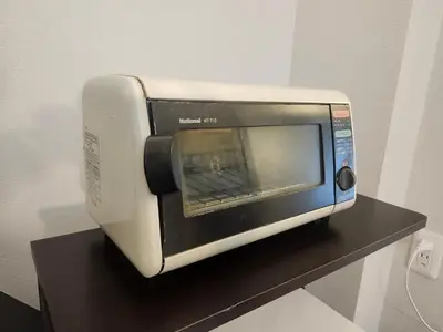 a toaster oven sitting on top of a table at Ark Hills Haneda Inn in Tokyo