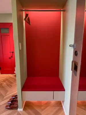 a red closet with a red bench in a room at the Moto Hotel Ueno II in Tokyo