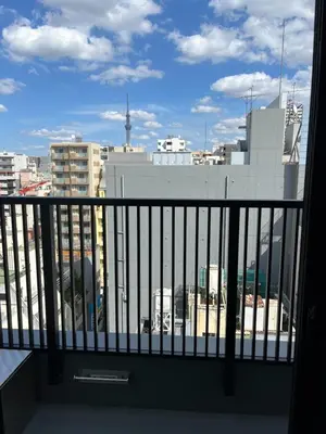 a view of a city from a balcony at the Moto Hotel Ueno II in Tokyo