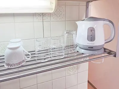 a mixer and glasses on a shelf in a kitchen at Tokyo Stay West Sugamo #103 in Tokyo