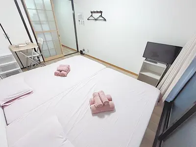 a hospital room with a bed with towels on it at Tokyo Stay West Sugamo #103 in Tokyo