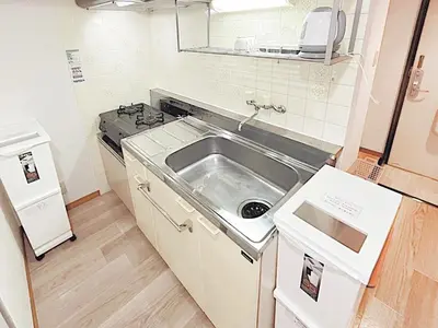 a small kitchen with a sink and a stove at Tokyo Stay West Sugamo #103 in Tokyo